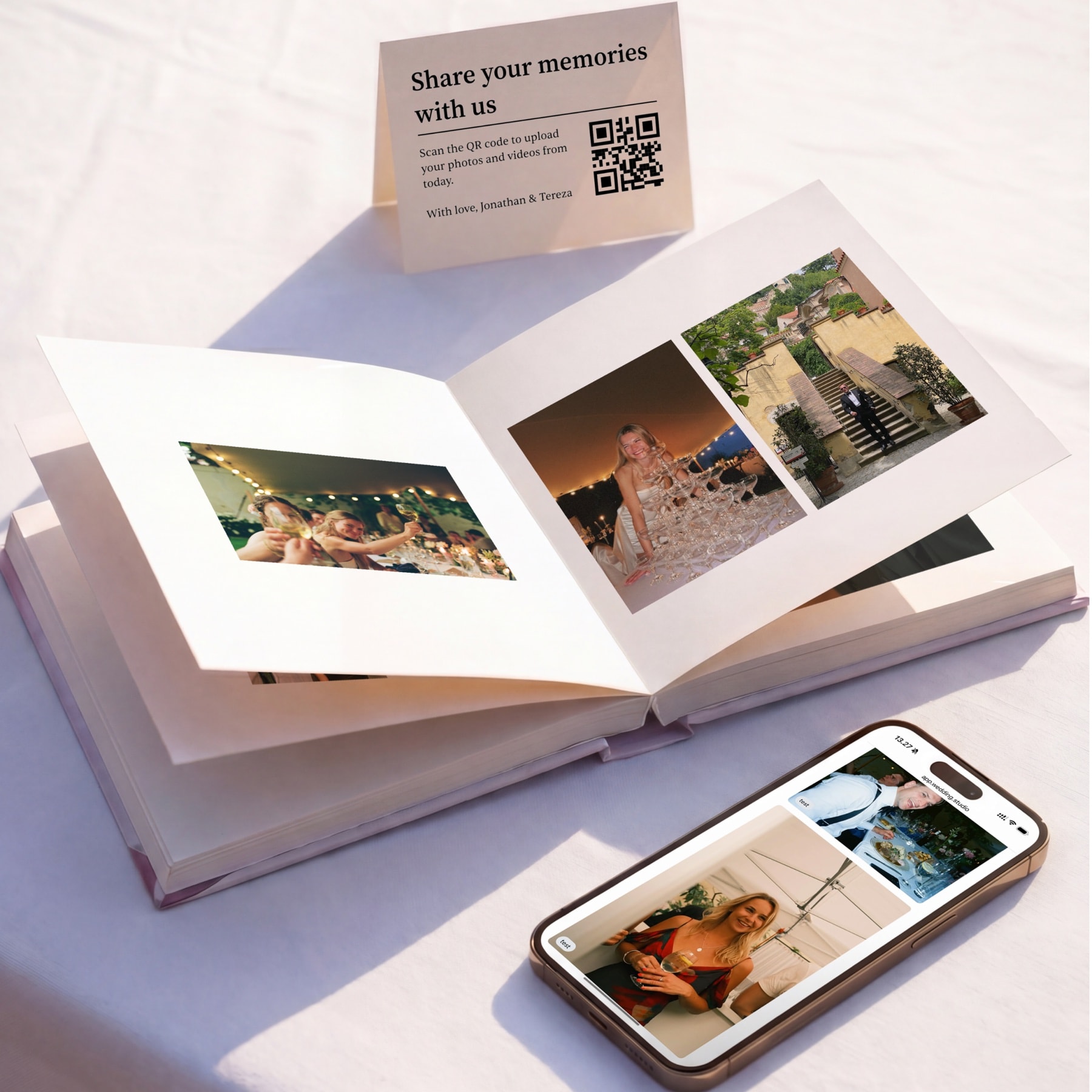 Open photobook beside a printed QR card and a phone showing the same guest photos