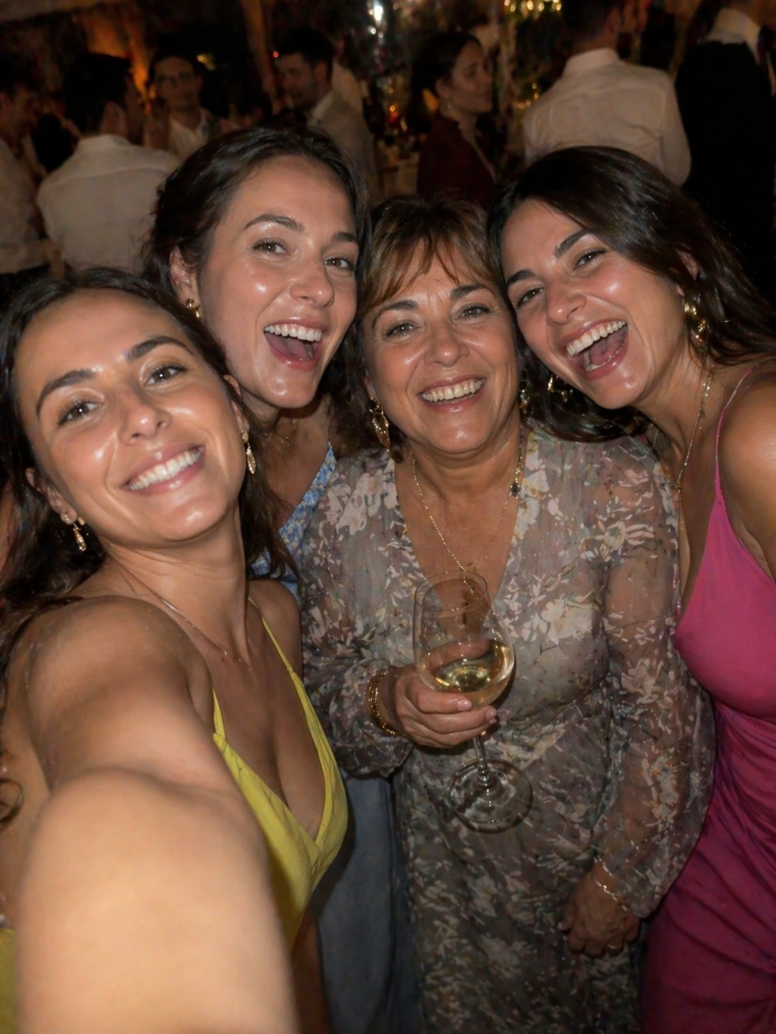 Wedding guests taking a joyful selfie with family